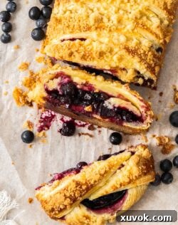 Top down view of a couple of slices cut away from the blueberry danish braid.