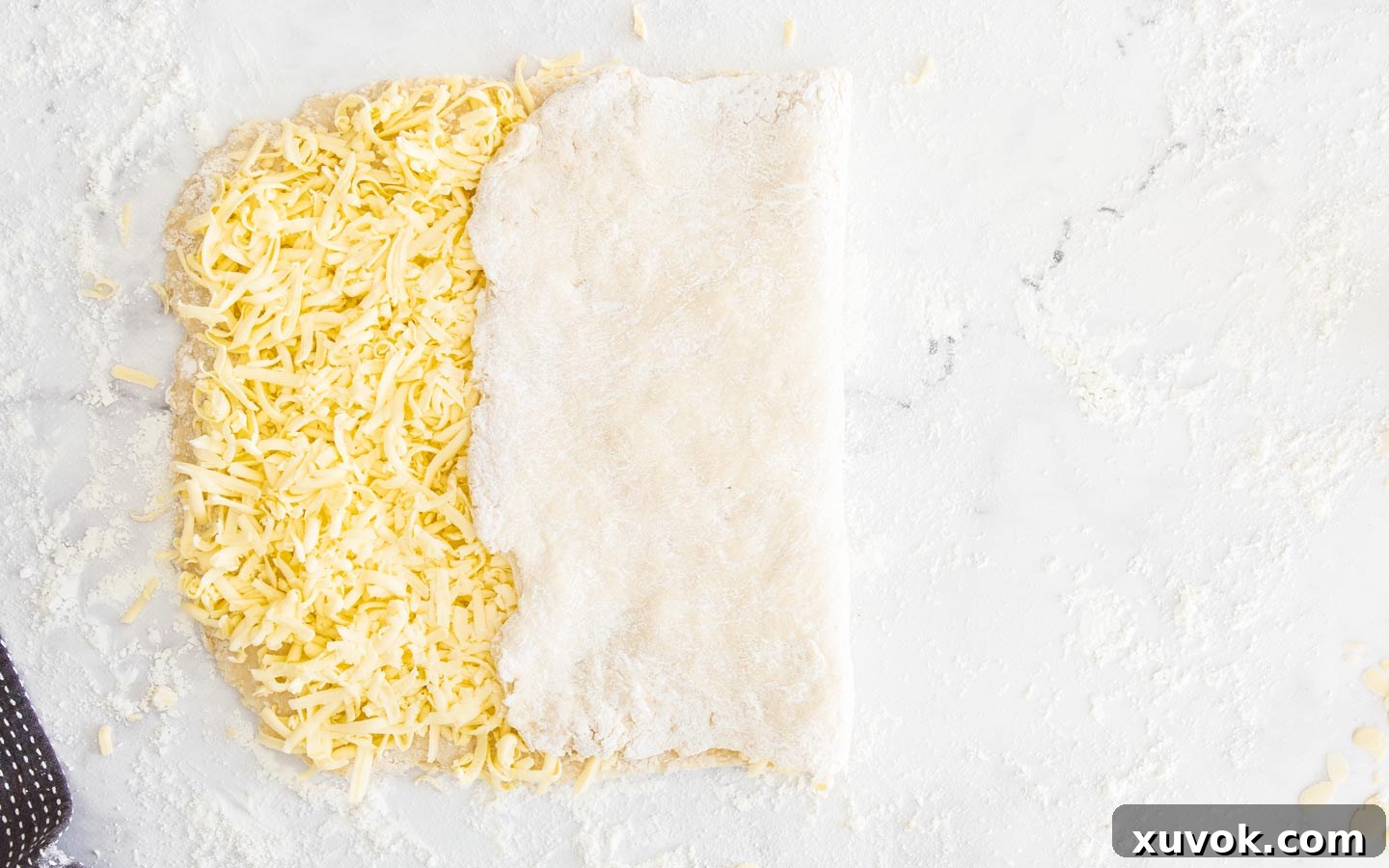 One side of the Danish dough, without butter, folded over the middle section.