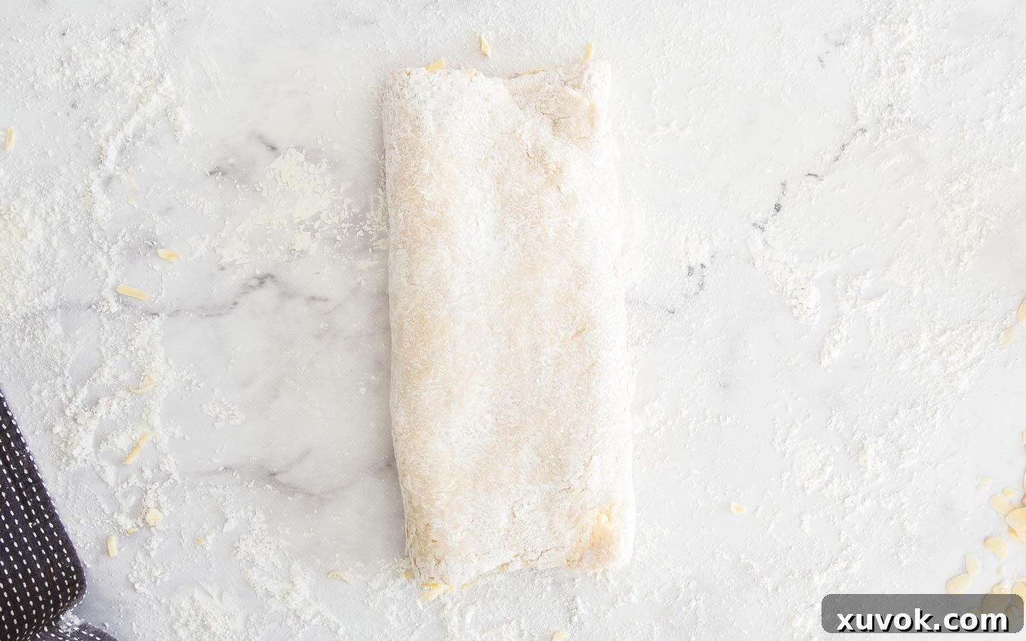 The second side of the Danish dough folded over the top, completing the letter fold.
