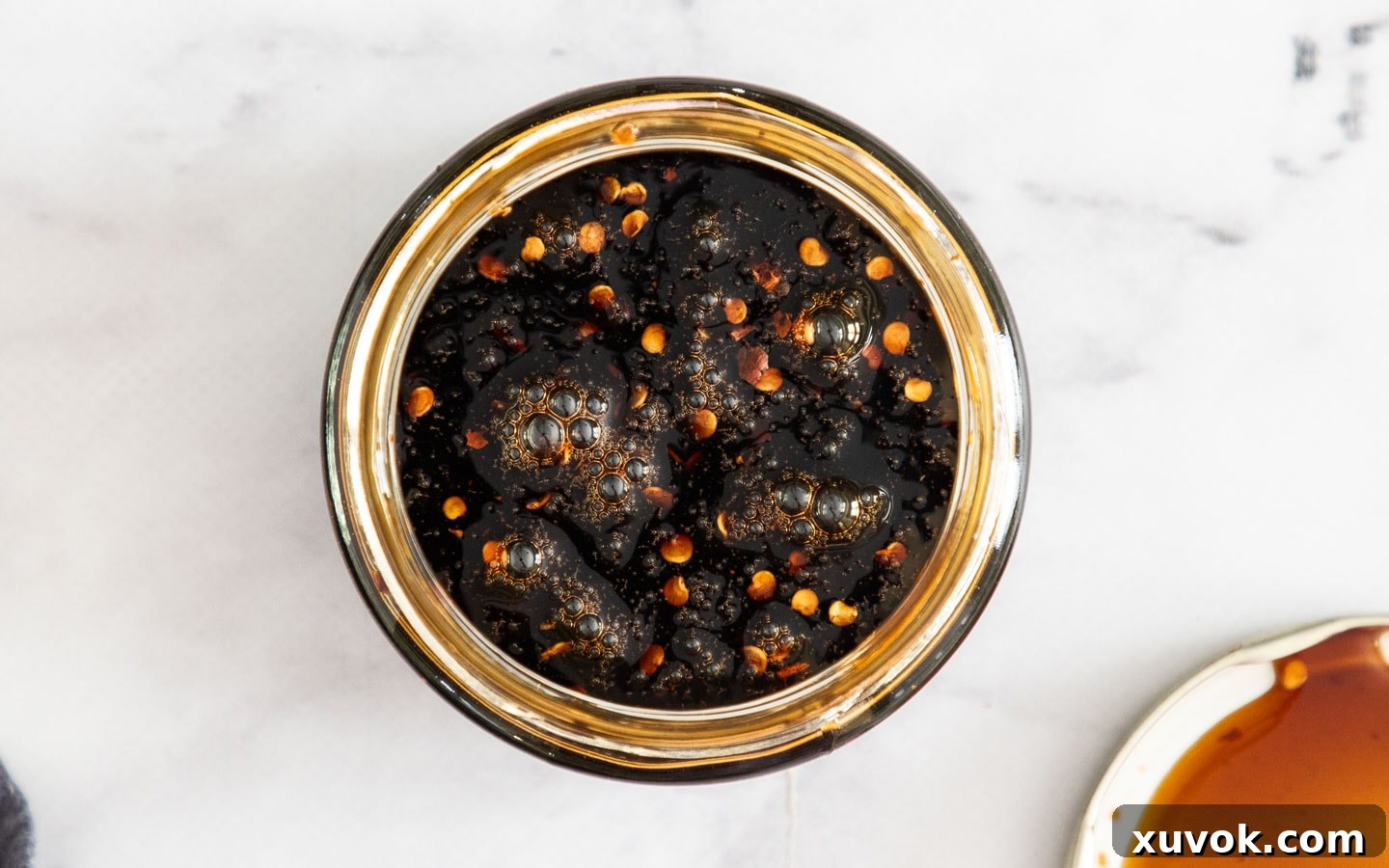 The vibrant stir-fry sauce ingredients perfectly mixed in a glass jar, ready for use.