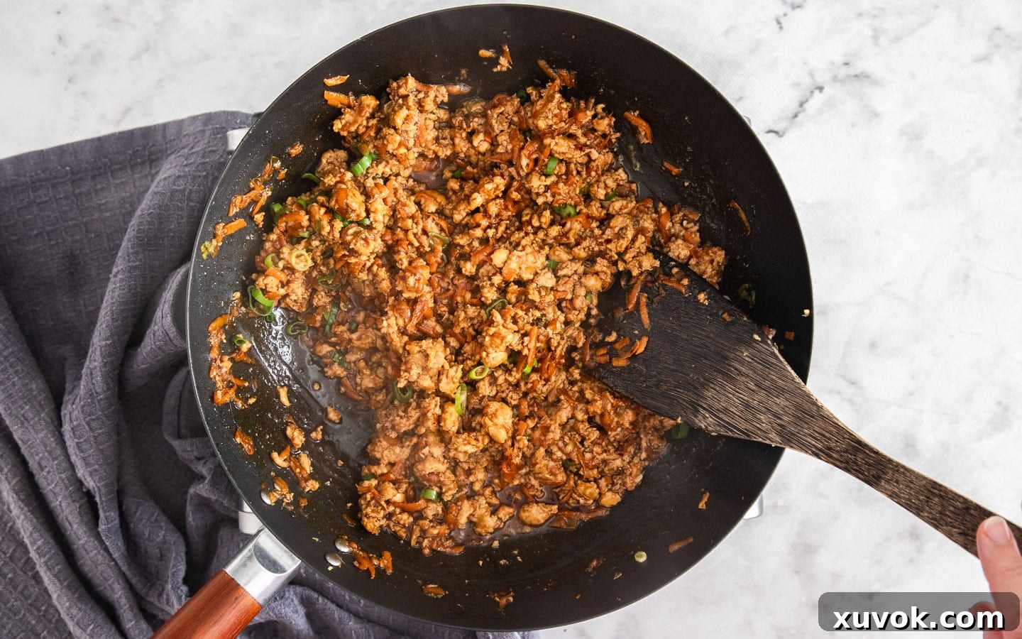 The vibrant, finished chicken mince stir fry, garnished and ready to be enjoyed.