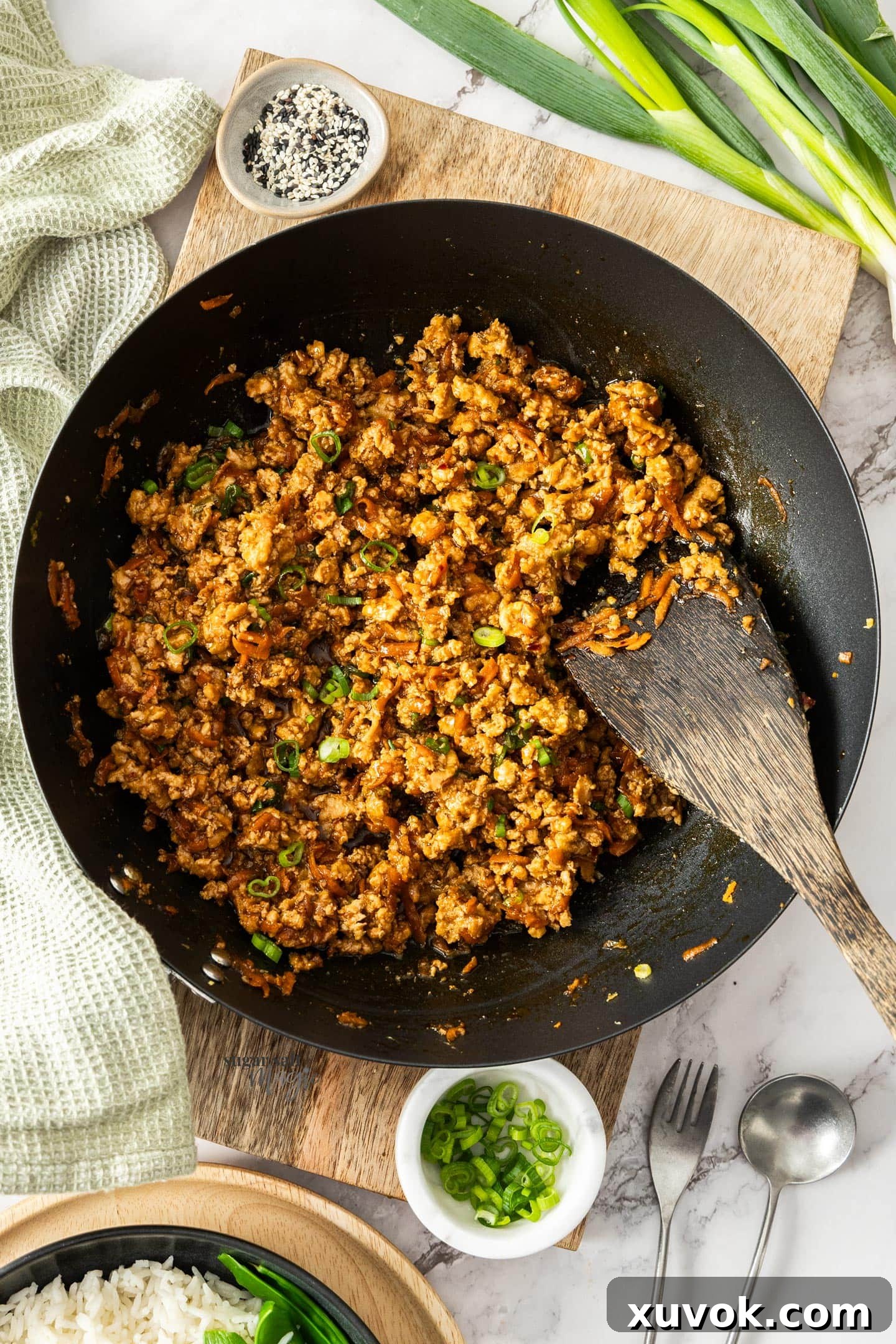 An inviting top-down view of the chicken mince stir fry simmering in a traditional wok, showcasing its rich texture.