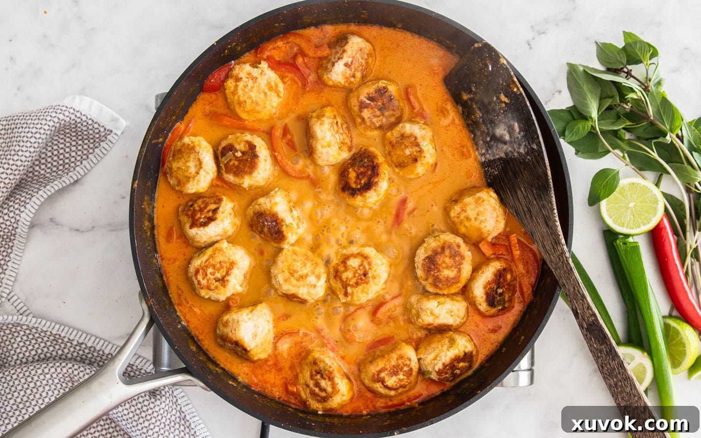 The meatballs in the thickened sauce.