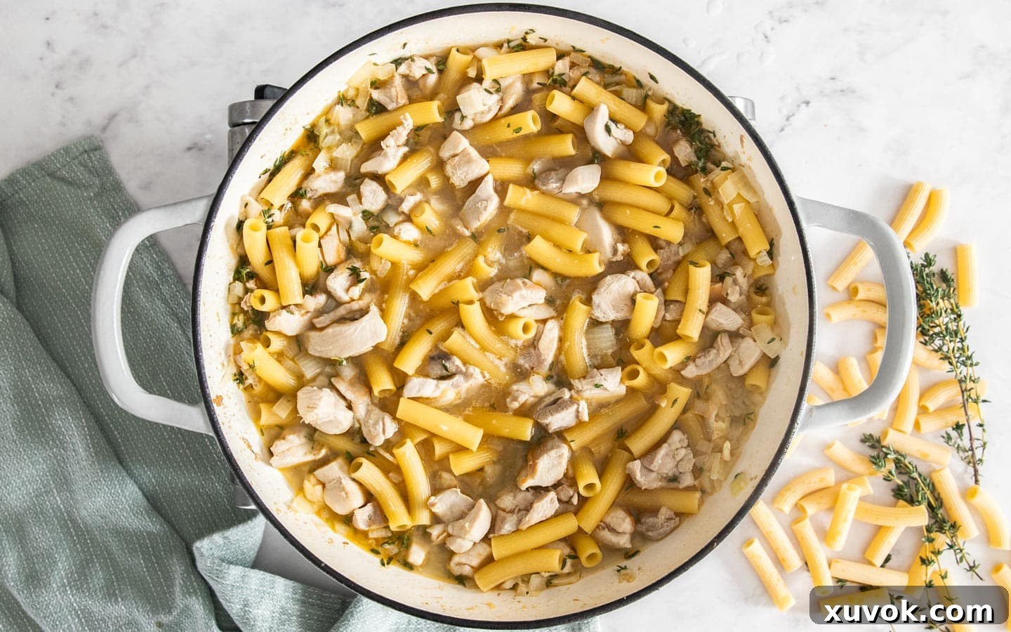 The pasta added to the pan, ready to bake.