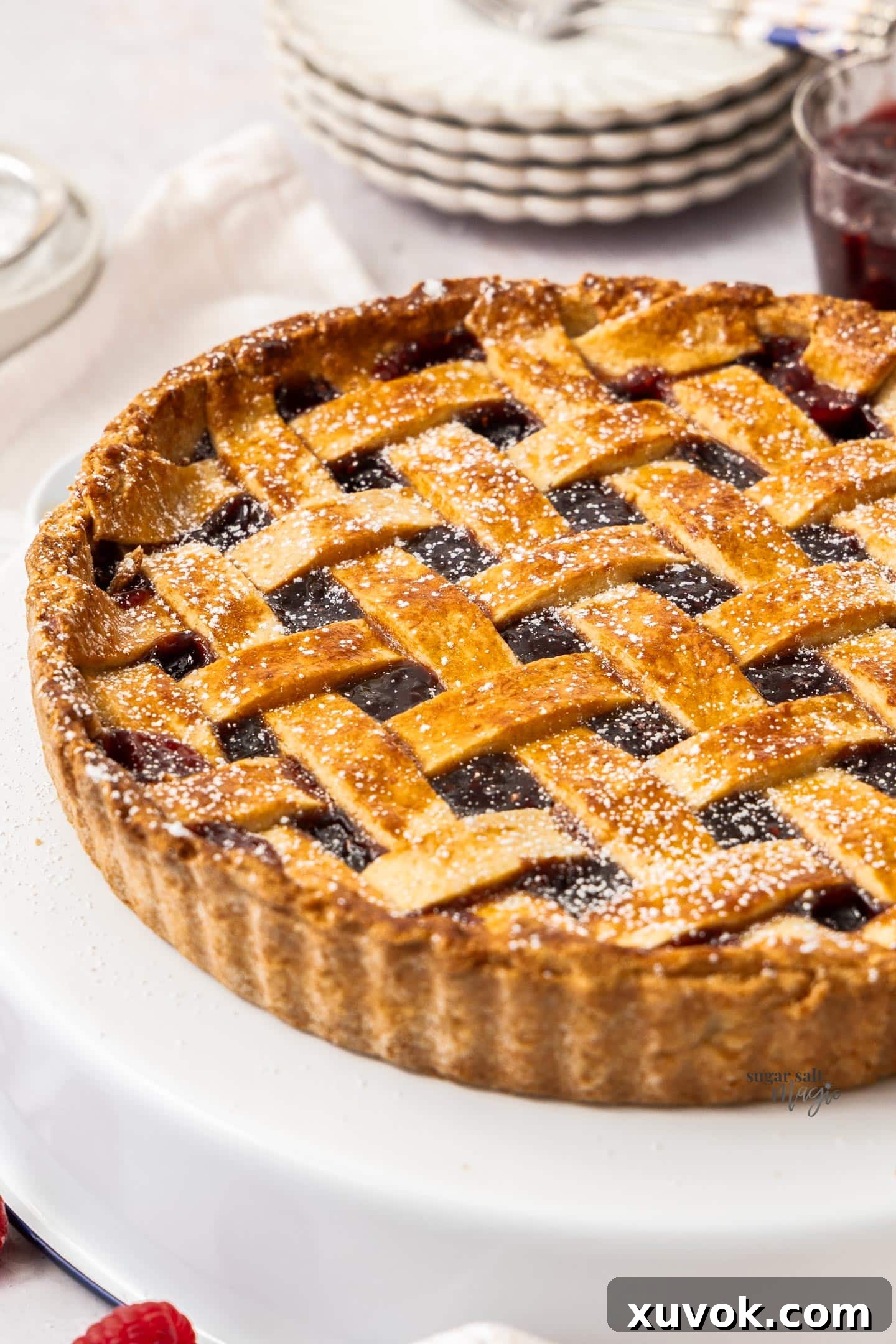 A whole linzer tart on a platter.