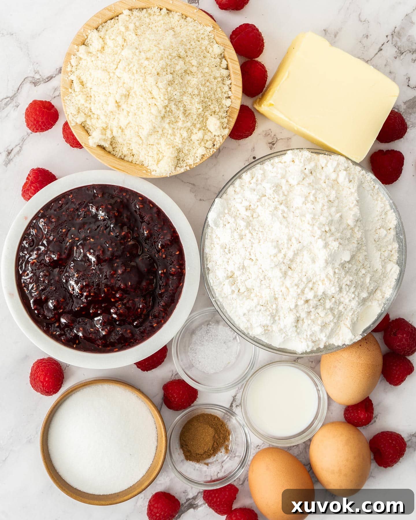 Ingredients for linzer torte on a marble background.