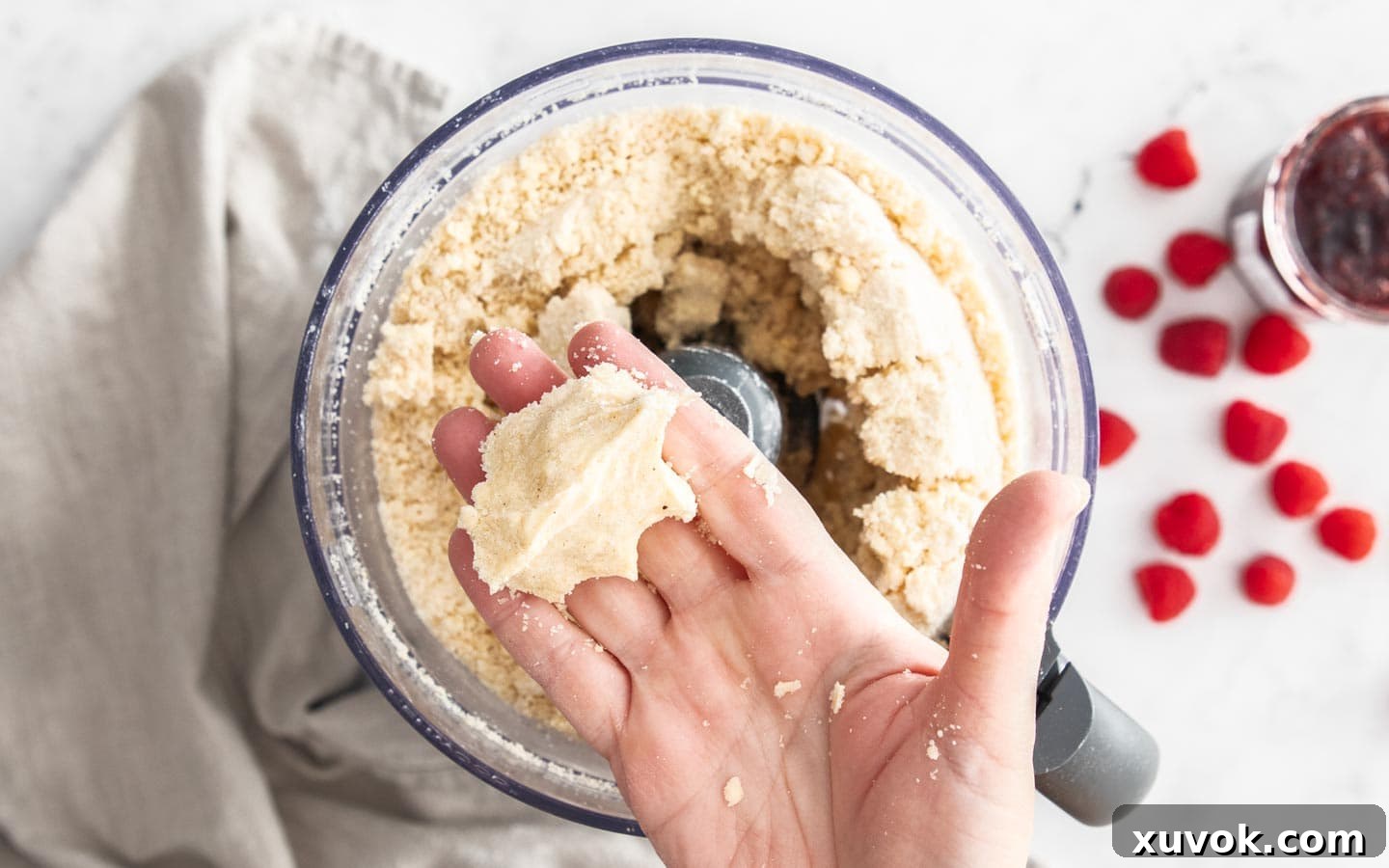 A hand showing how to know when the dough is ready.
