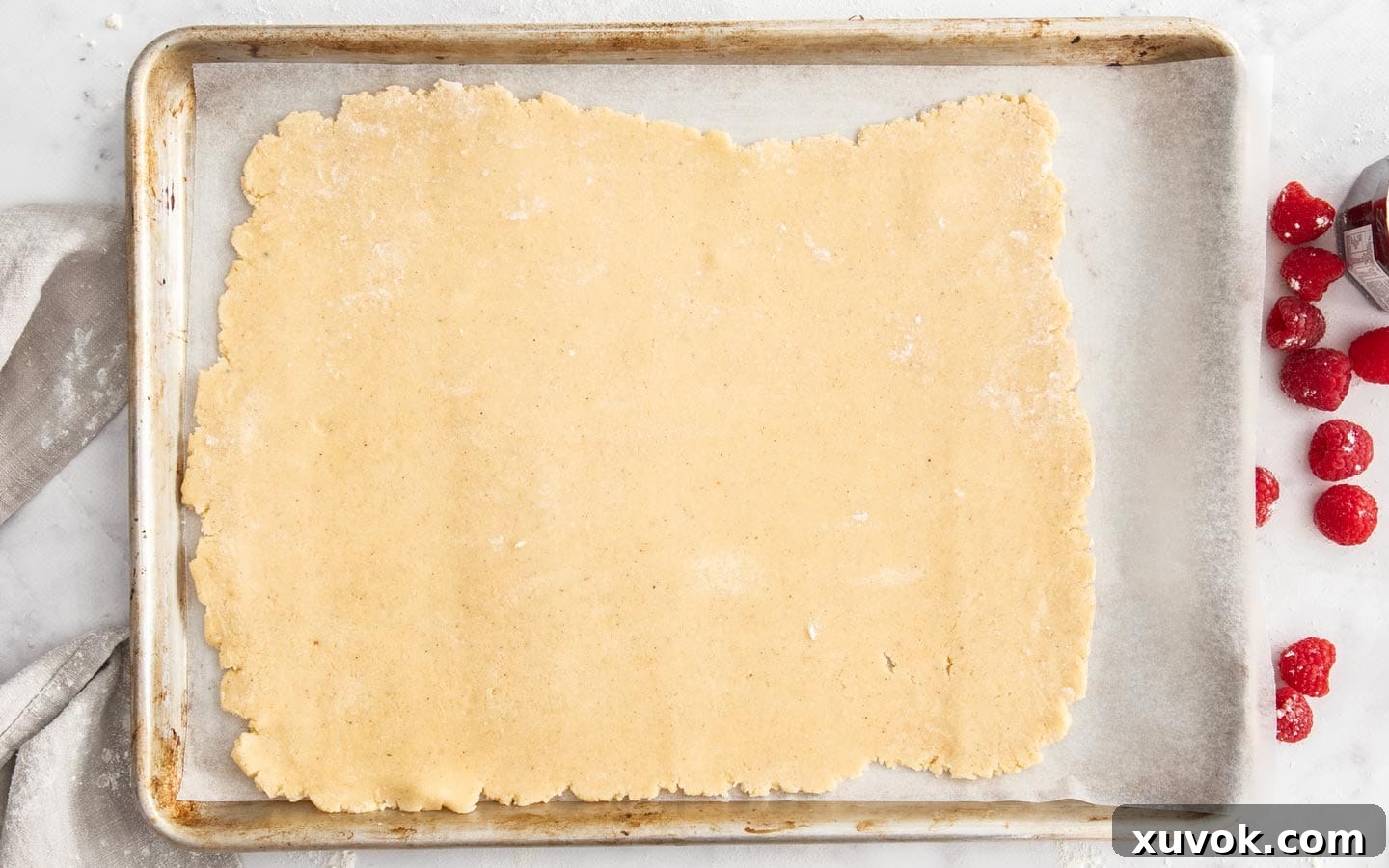 The rolled out dough on a baking sheet.