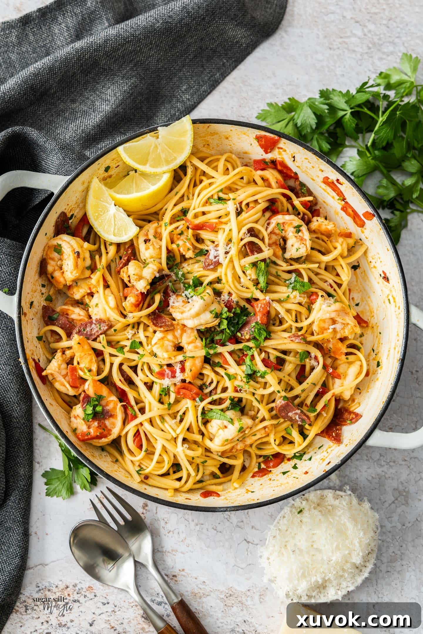Top down view of the prawn and chorizo pasta in an enamel pan.