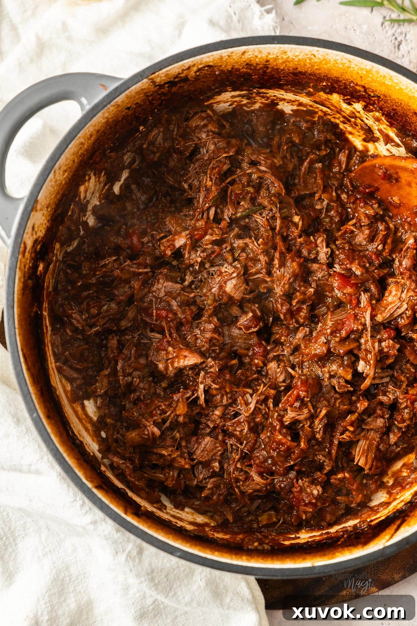 A dutch oven filled with beef shin ragu.