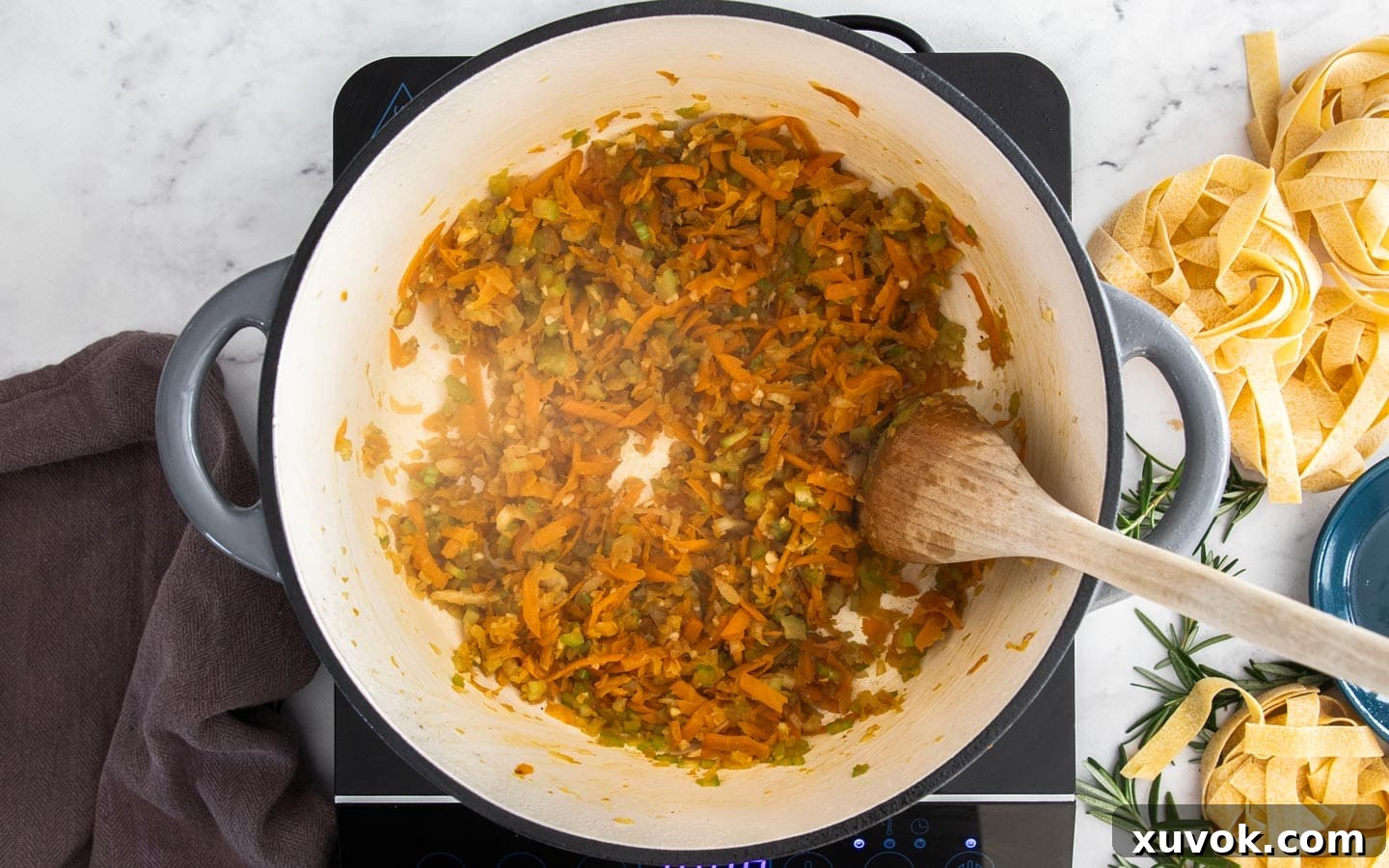 The vegetables softening in the pan.