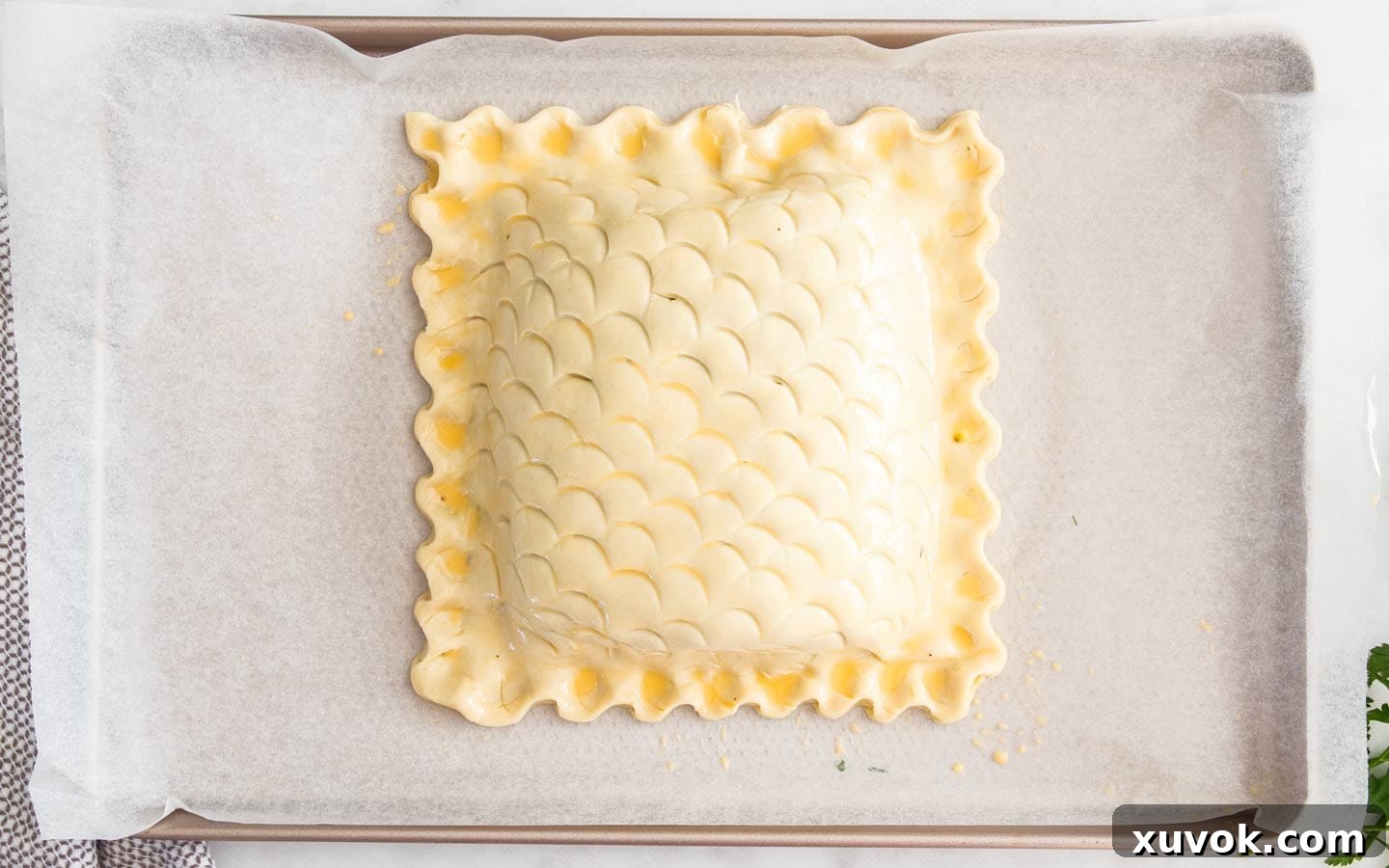 The finished salmon en croute brushed with egg wash, ready for the oven.
