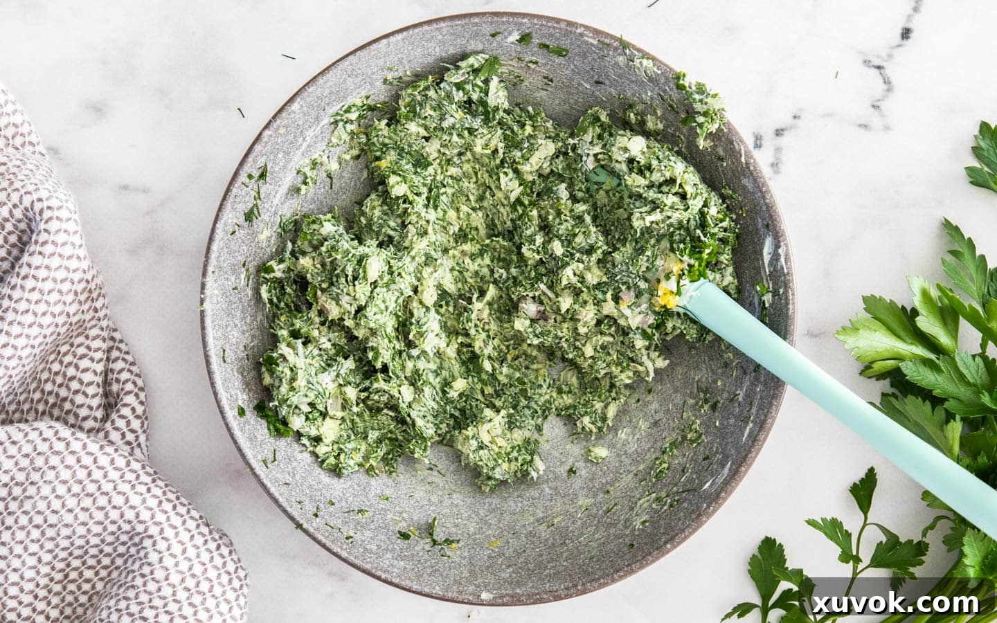 The herb and mascarpone mixture in a bowl, ready to be spread.