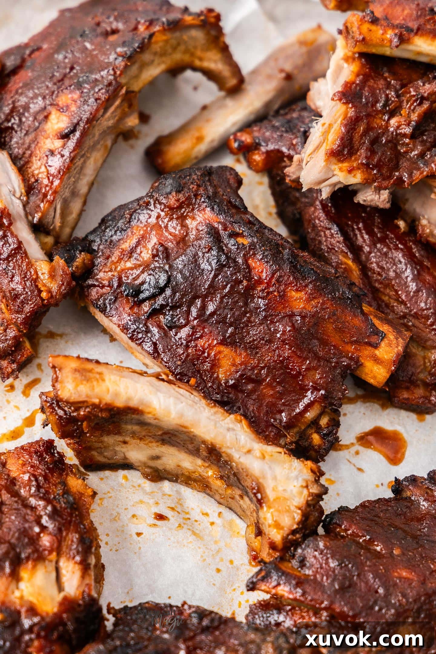 A generous platter piled high with mouth-watering BBQ pork ribs, ready to be served and enjoyed.