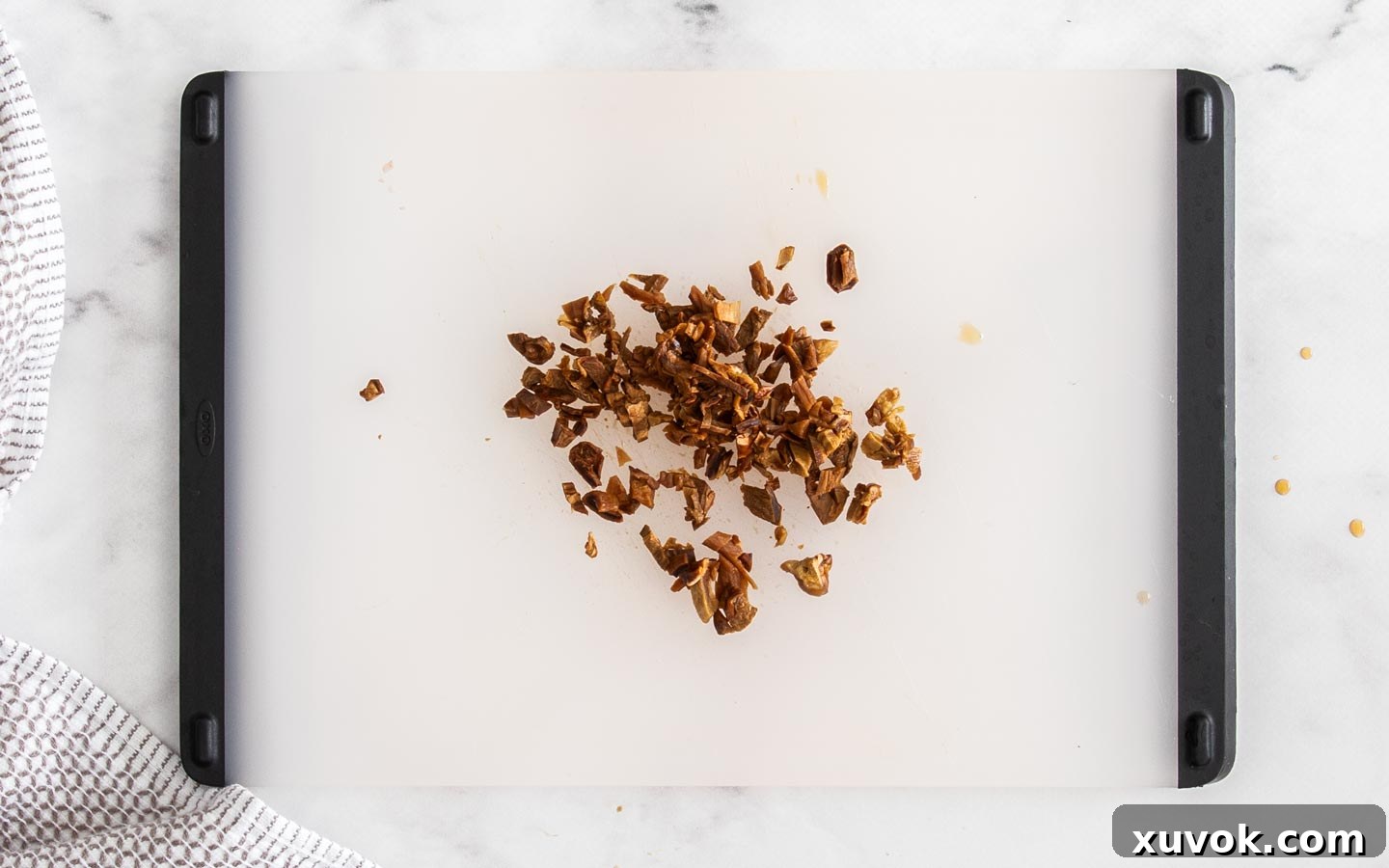 Finely chopped rehydrated porcini mushrooms neatly arranged on a chopping board, ready to be added to the risotto.