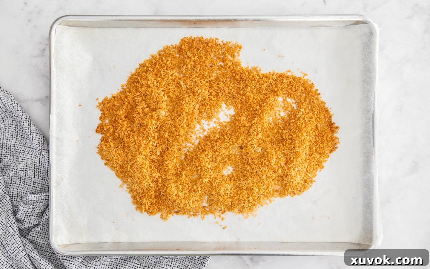 Golden brown Panko crumbs after baking, showing a rich, even color.