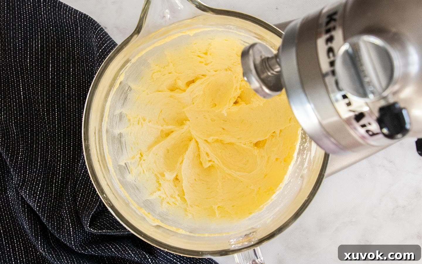 The butter mixture creamed together in a mixing bowl.
