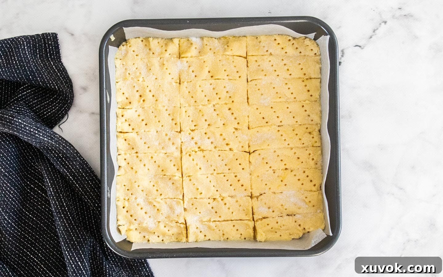 The dough with sugar scattered over the top.