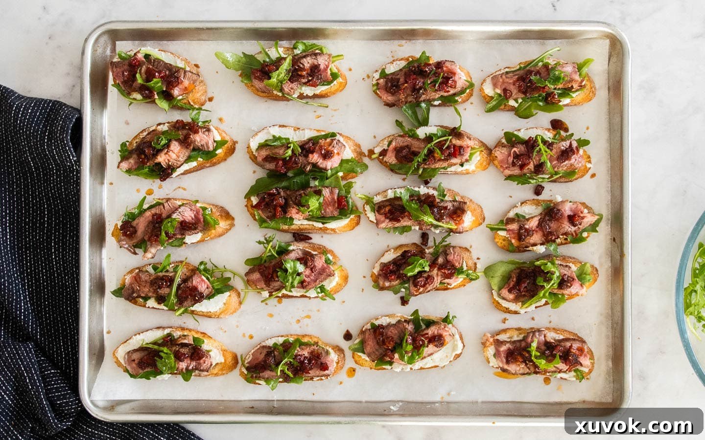The finished crostini topped with sun dried tomatoes.
