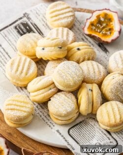 Top down view of a pile of passionfruit melting moments.