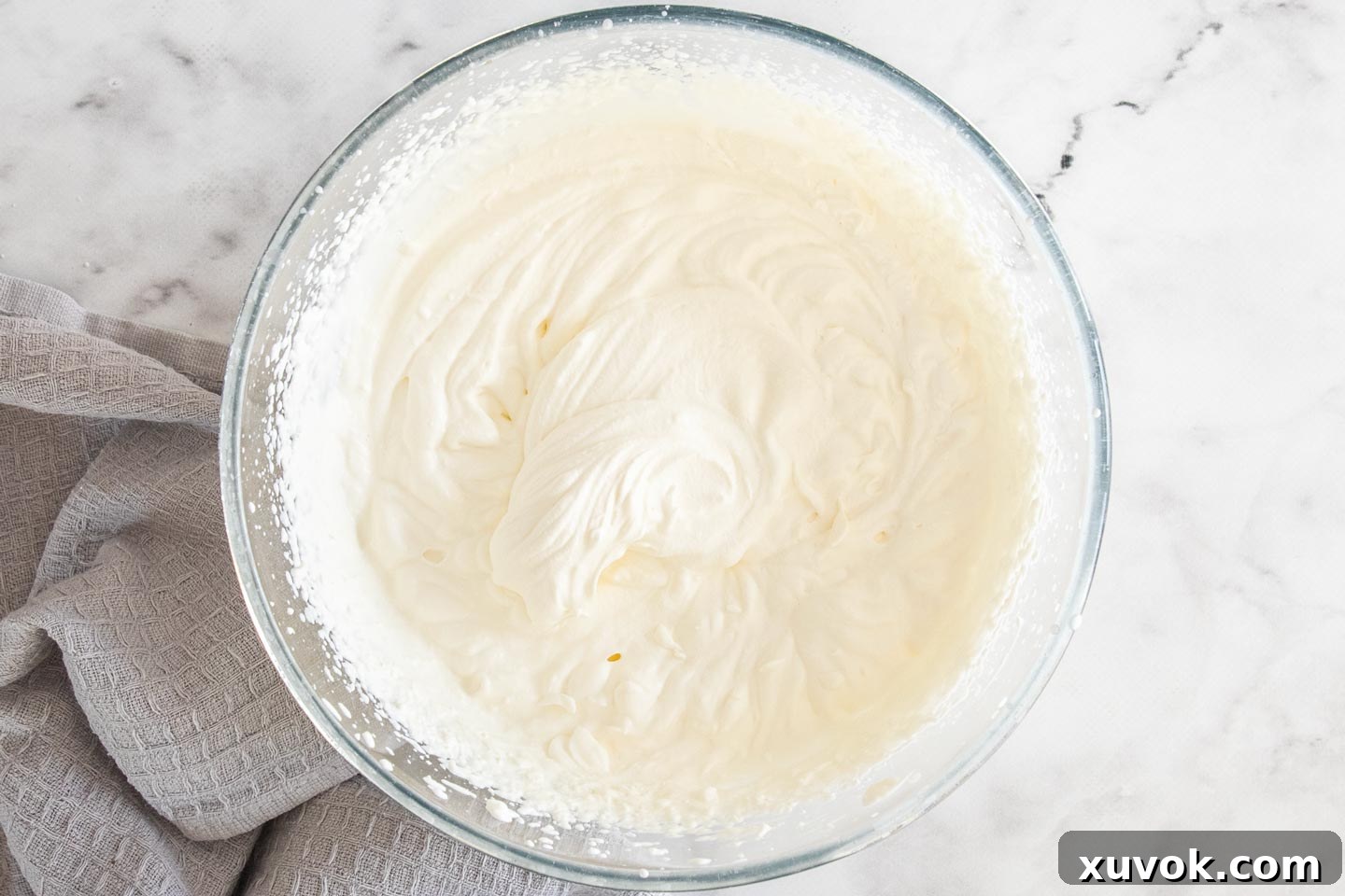 The whipped cream in a bowl.