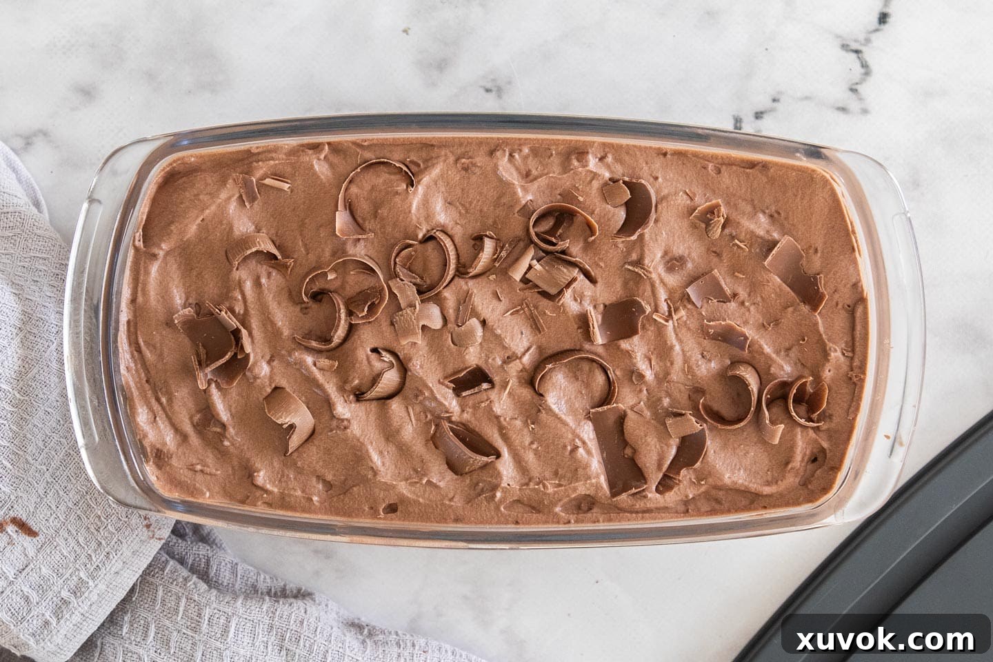The double chocolate ice cream in a glass loaf pan ready for freezing.