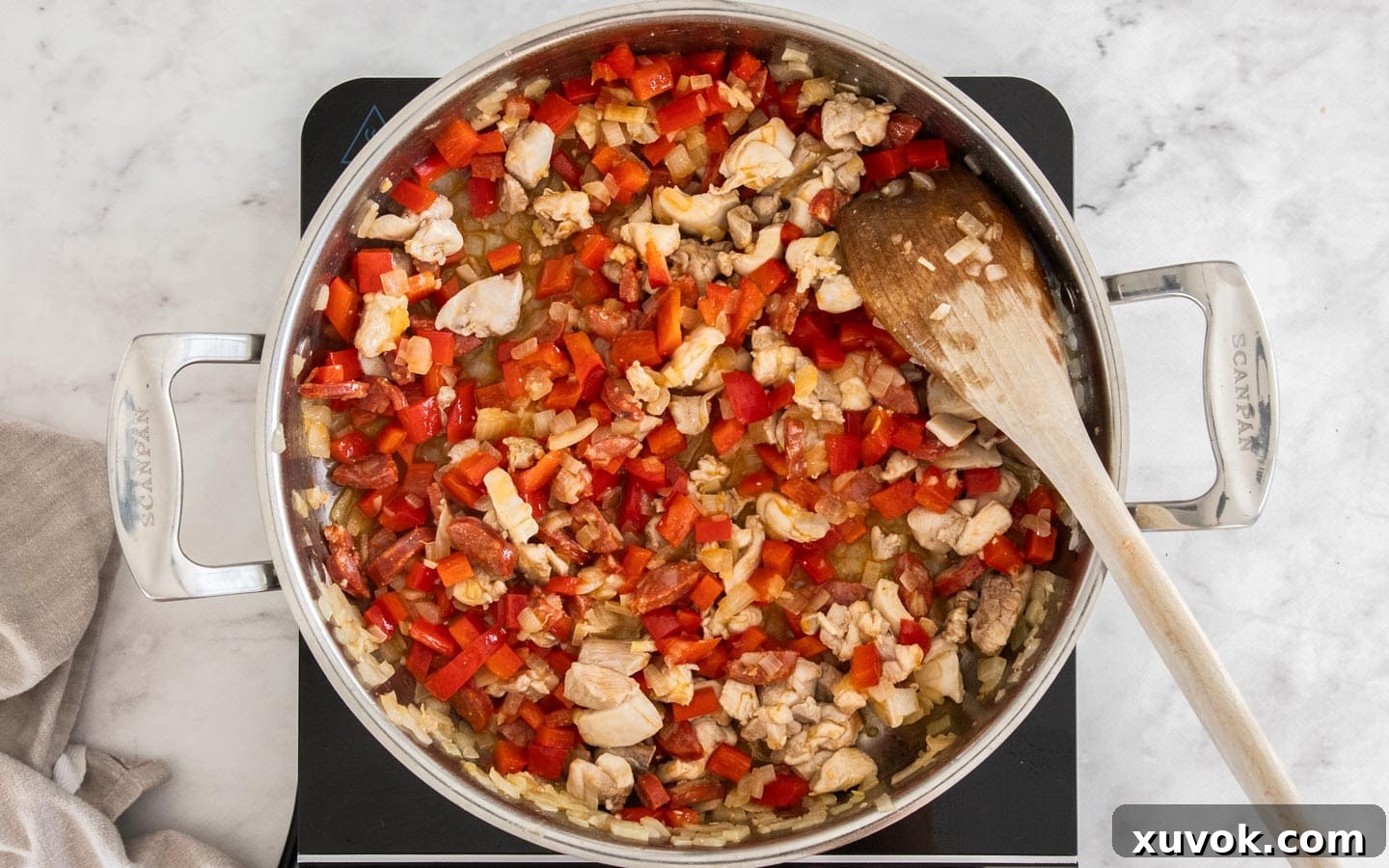 Capsicum added to the pan.