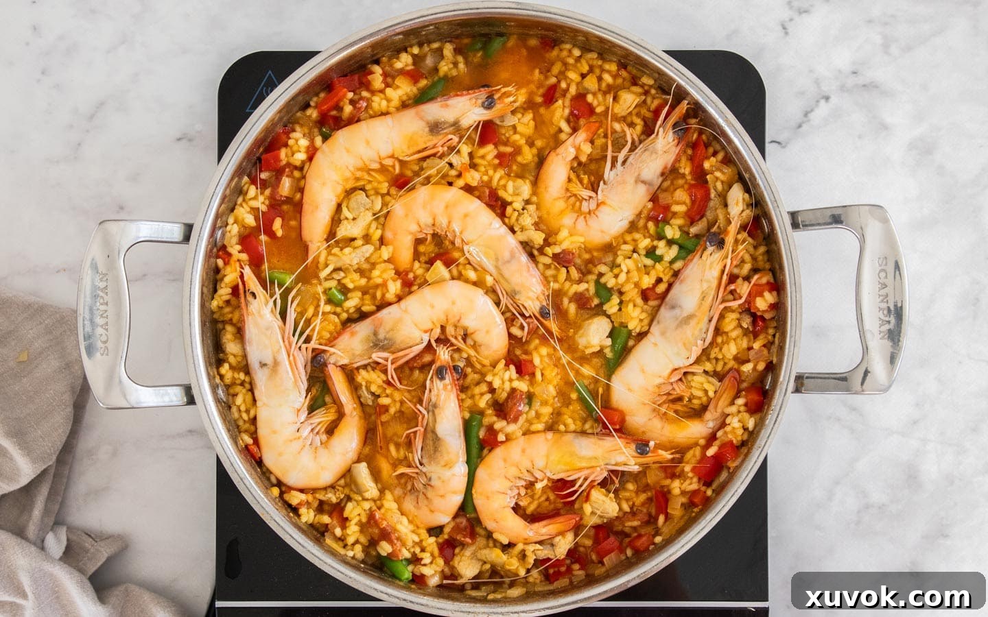 Cooked prawns on top of the paella.