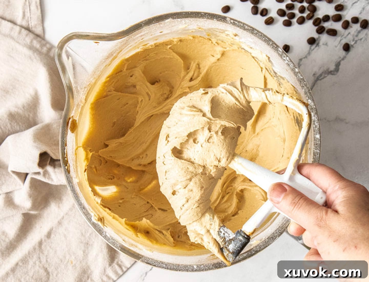Coffee buttercream in a mixing bowl.