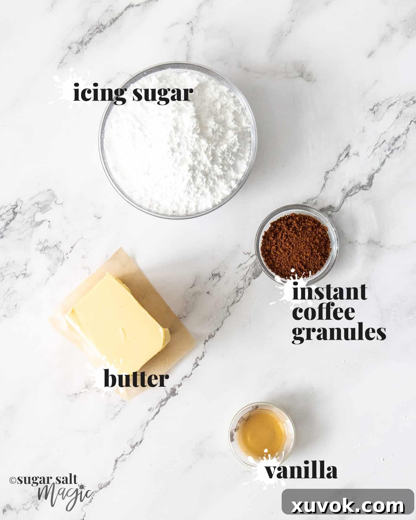 Ingredients for coffee buttercream on a white marble worktop.