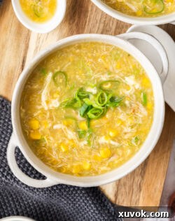 Top down view of a bowl of corn and crab soup.