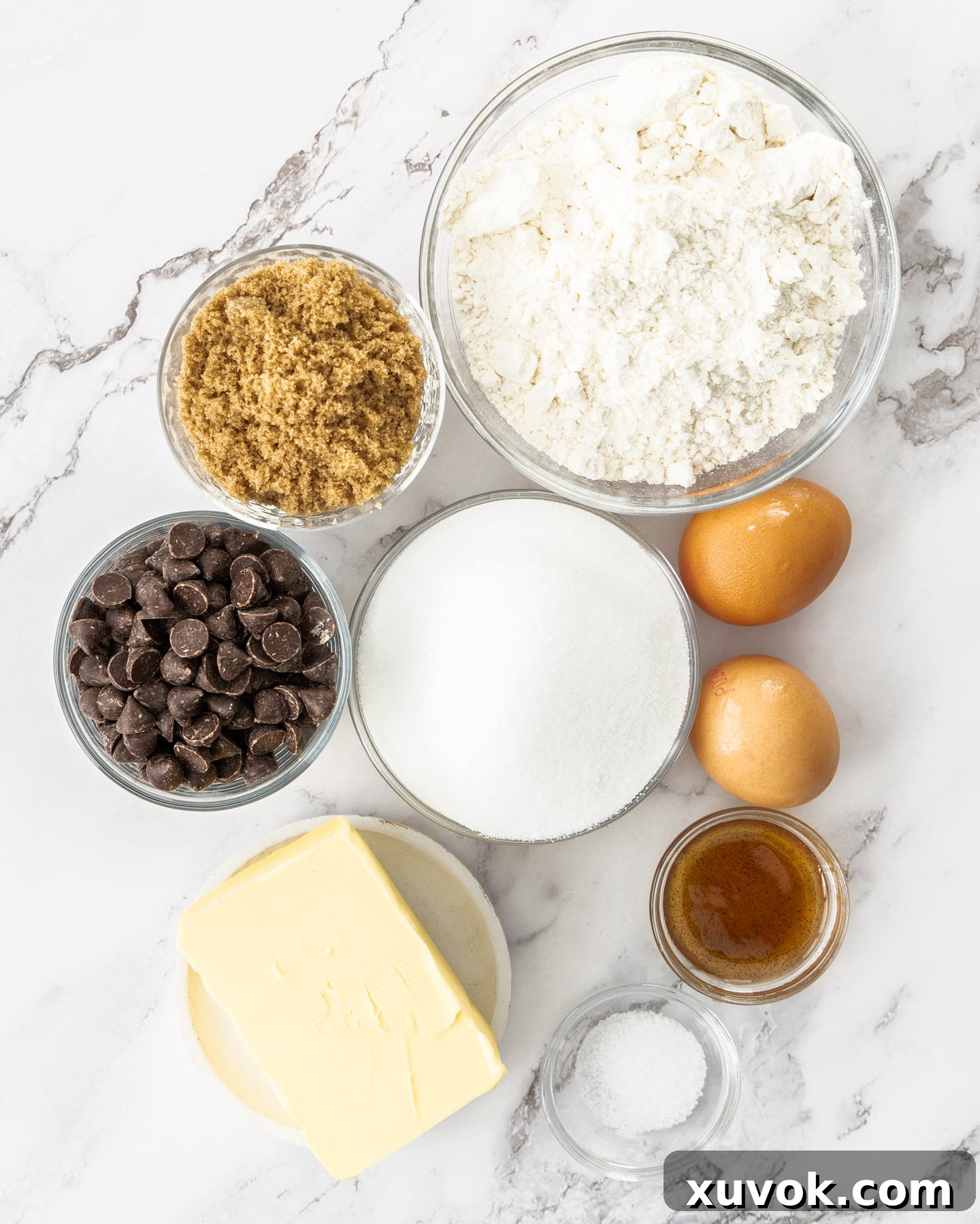 Ingredients for brown butter blondies laid out on a marble surface, ready for baking.