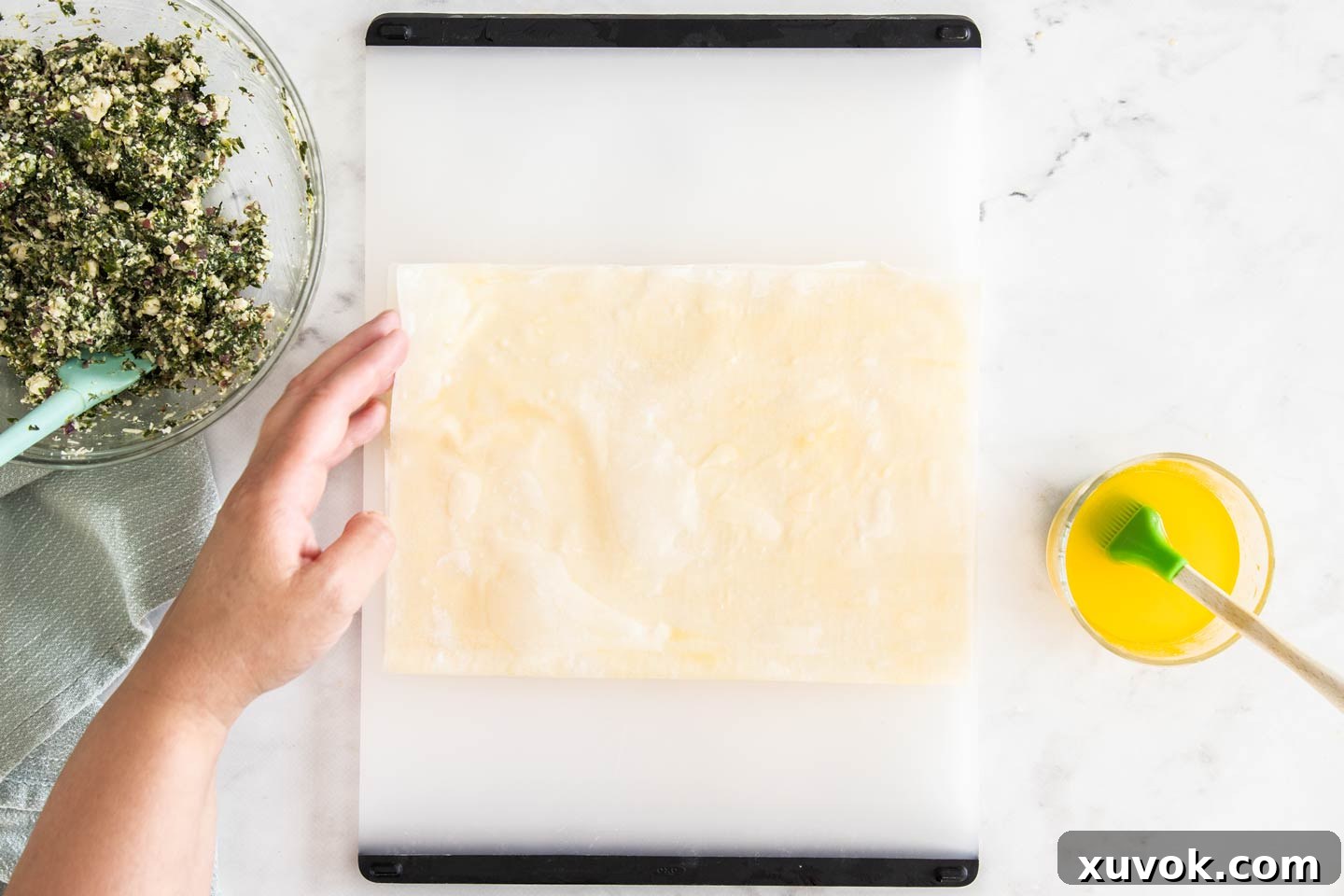 The double-layered filo pastry folded in half, creating a rectangle.