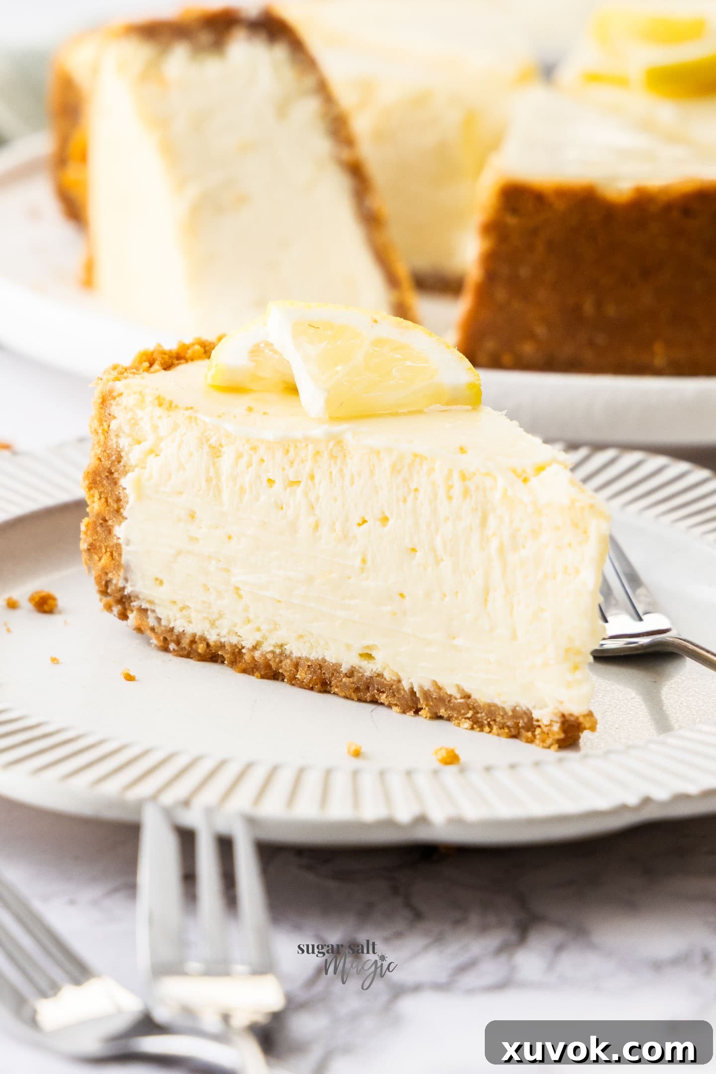 A slice of lemon cheesecake on a dessert plate.