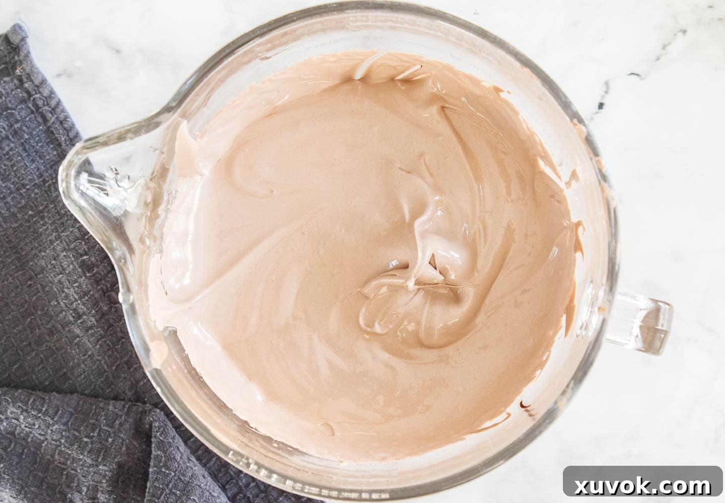 The perfectly whipped chocolate marshmallow mixture in a mixing bowl, ready to be transferred to a baking pan.