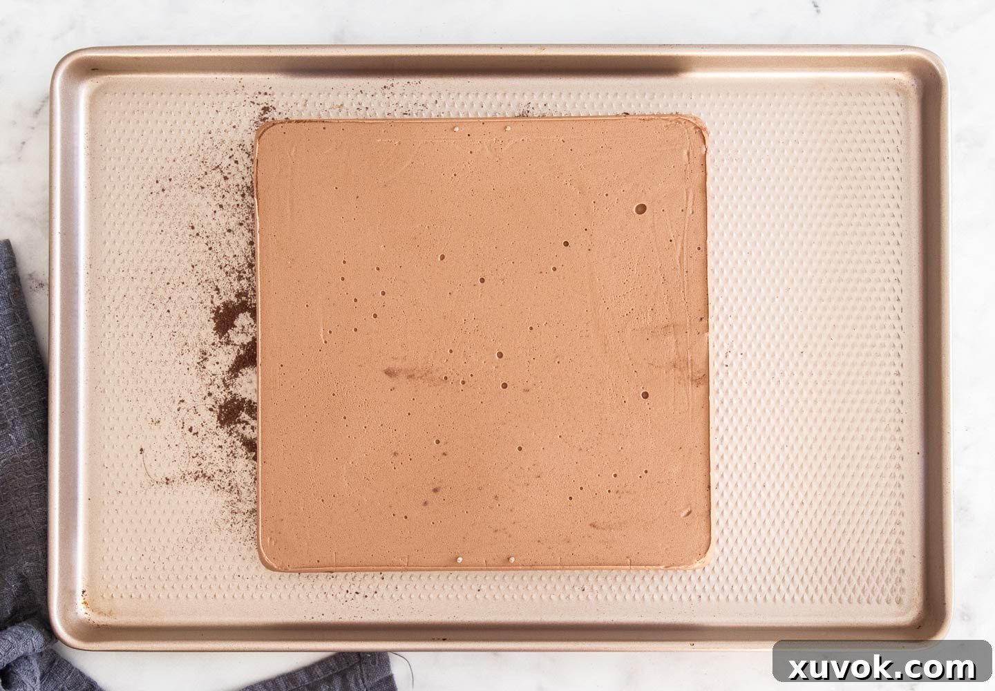 The fully set chocolate marshmallow block turned out onto a baking sheet, ready for cutting.