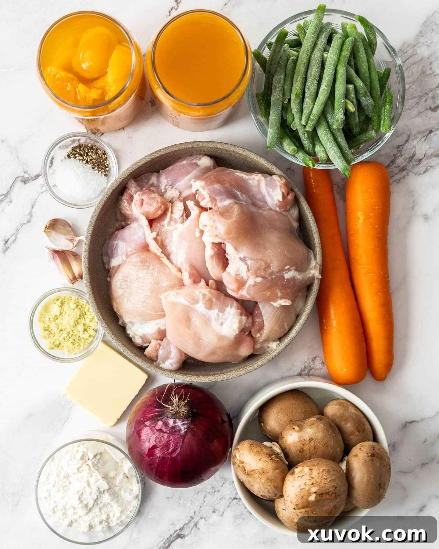 Ingredients for slow cooker apricot chicken laid out on a kitchen counter.