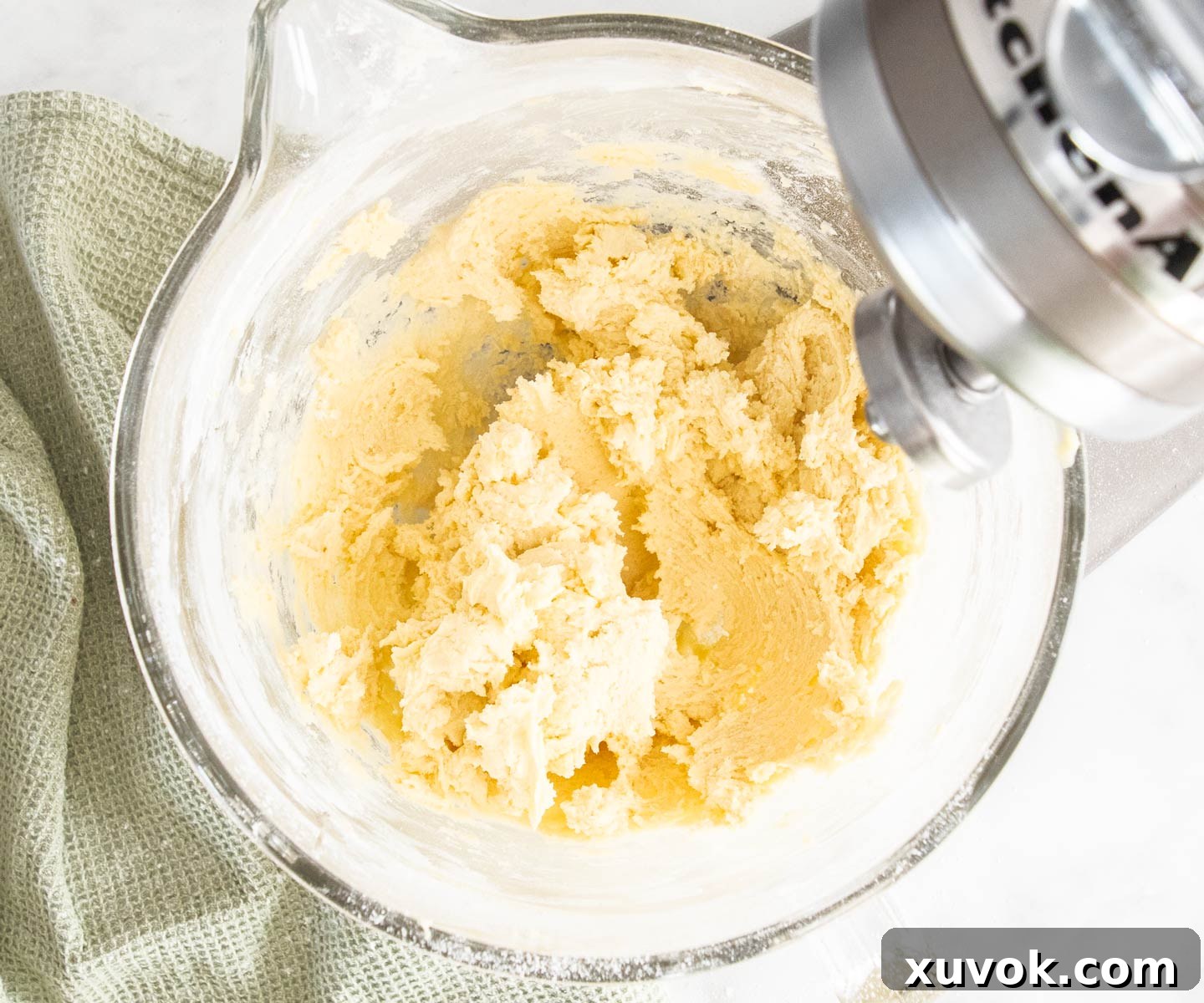 The fully mixed, sticky cookie dough for yo yo biscuits in a mixing bowl.