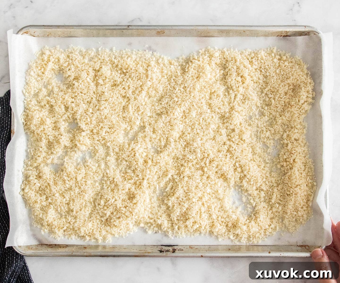 Crumbs on a baking sheet.