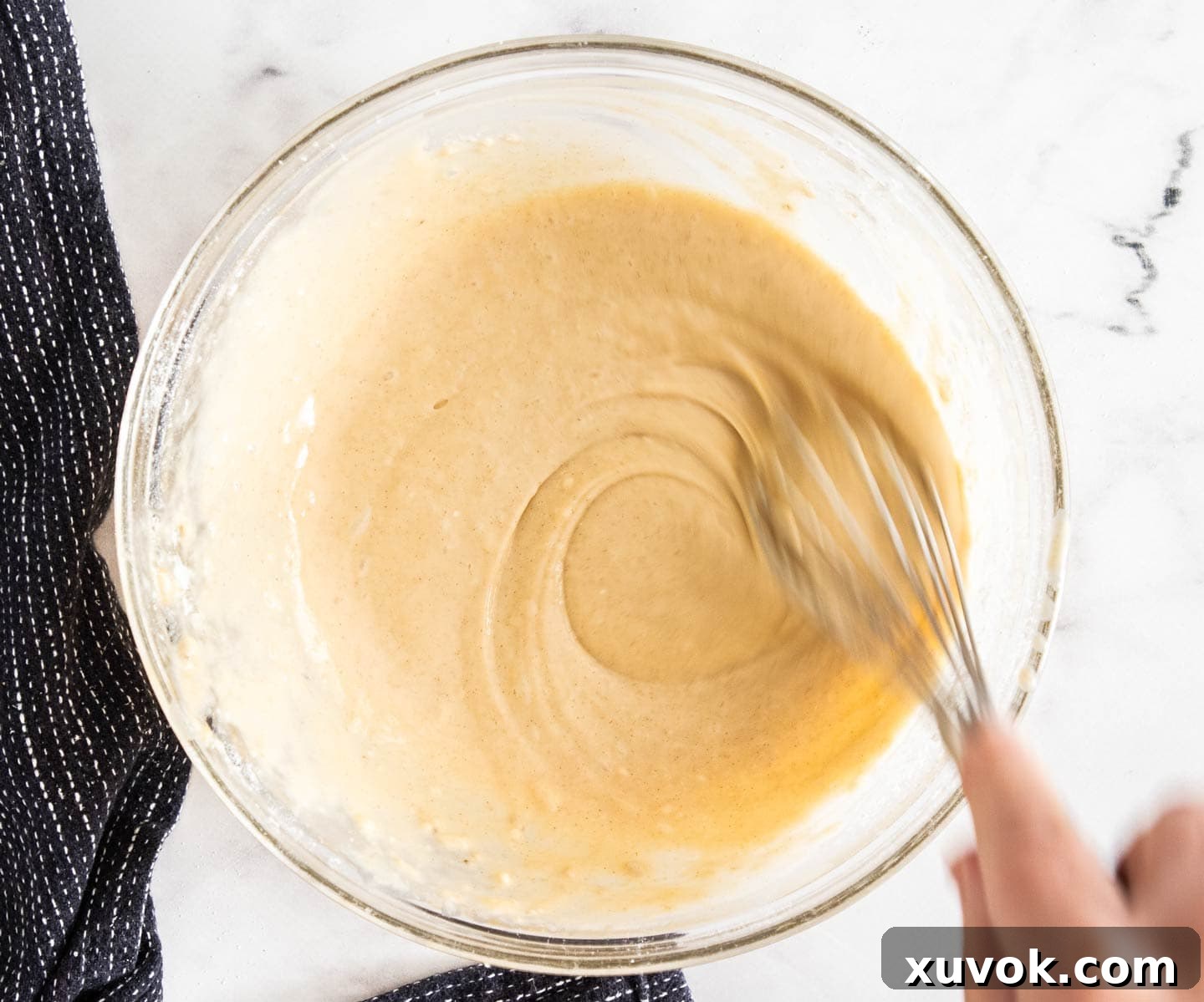 The batter for the chicken being whisked.