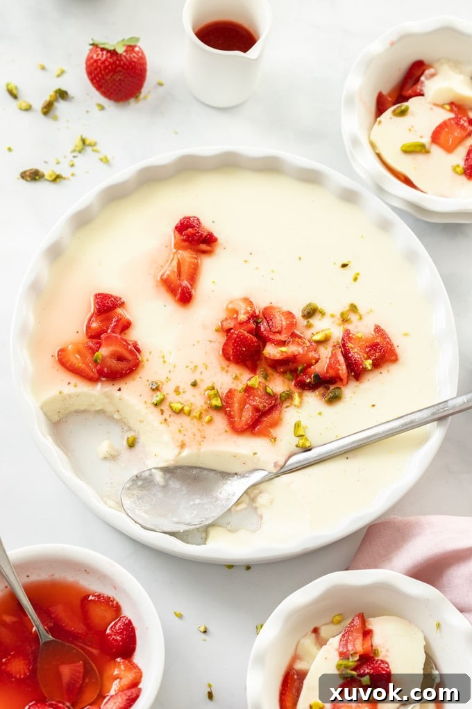 A large white dish filled with panna cotta, showcasing its elegant simplicity before serving.