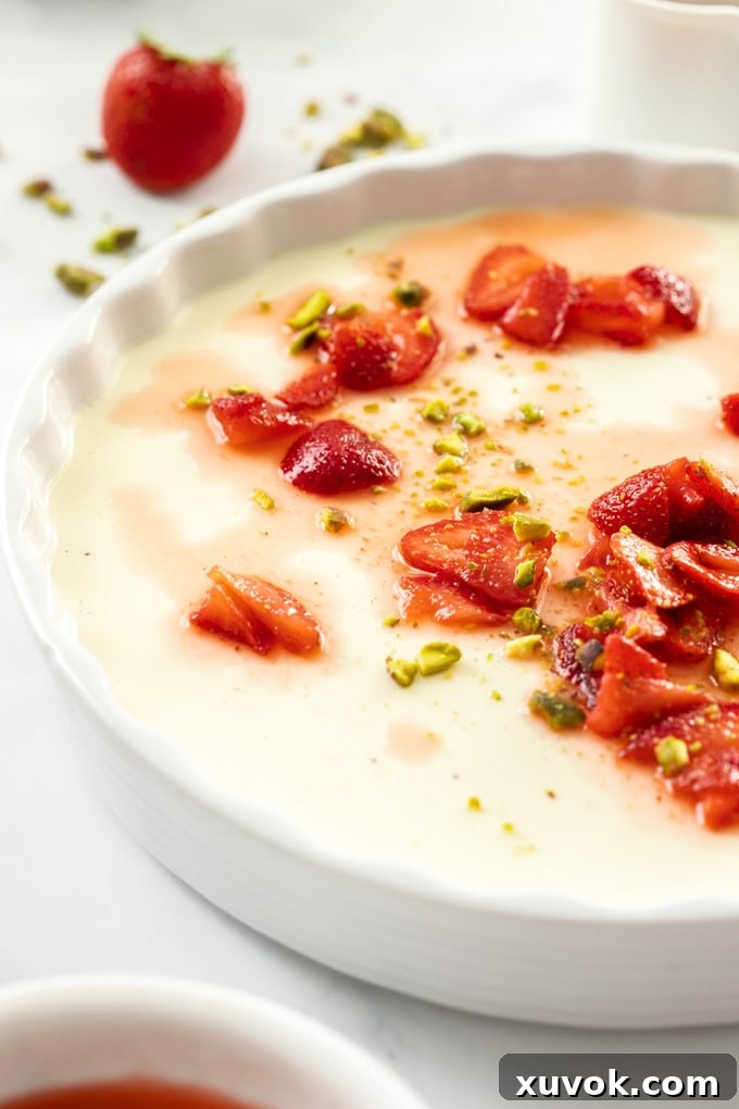 A close-up of the Strawberry Panna Cotta, highlighting the texture and topping.