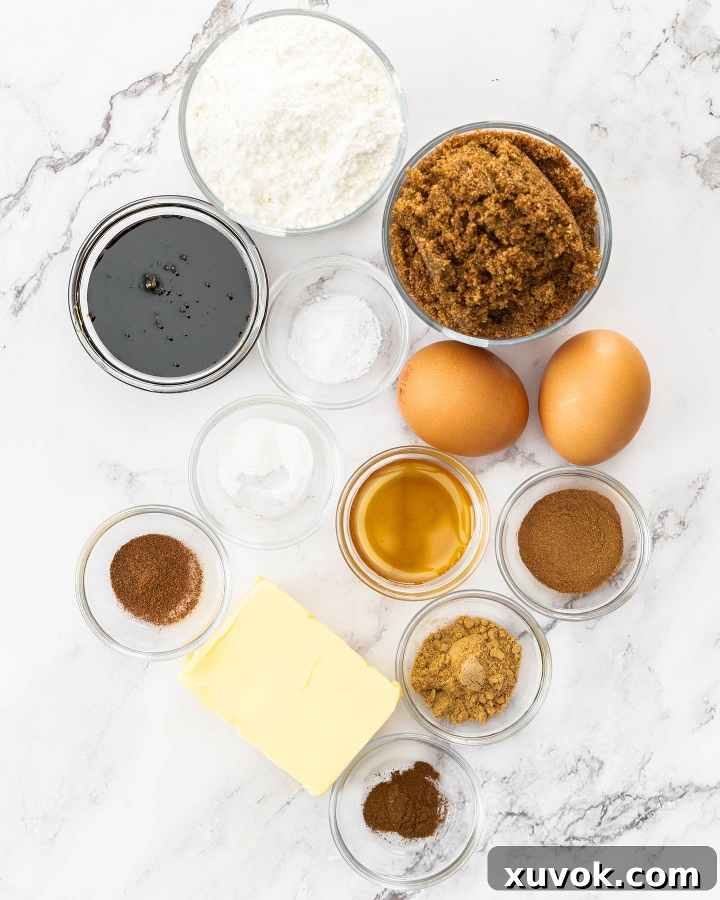 Ingredients for gingerbread blondies on a marble surface.