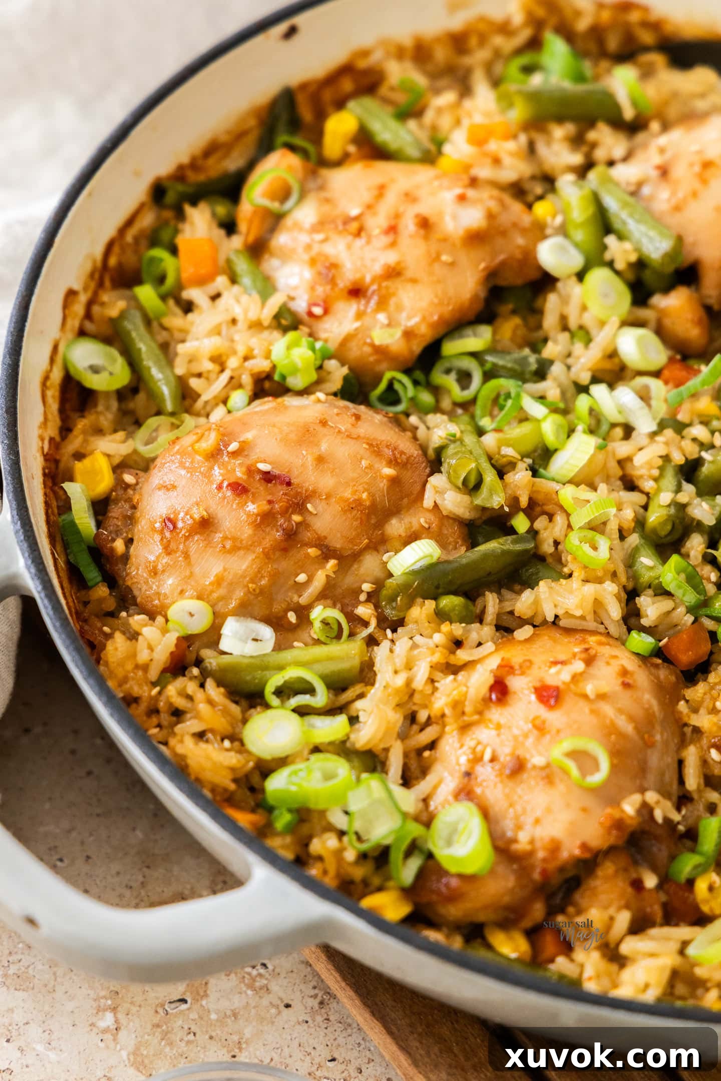 Angled view into the pan showing the baked chicken and rice.