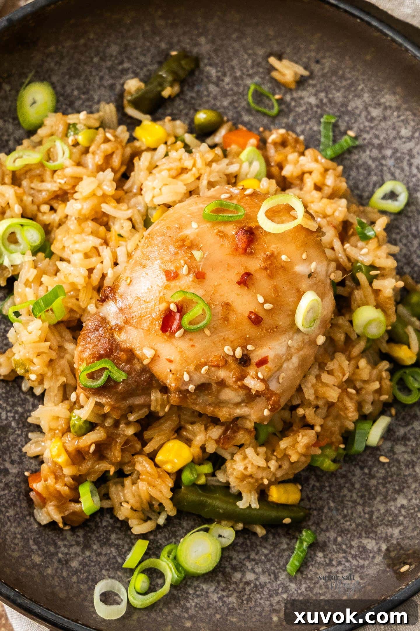 Top down view of the one pan chicken and rice bake on a dinner plate.