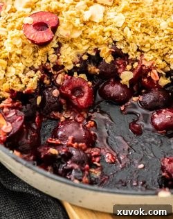 Extreme closeup of cherry crumble.