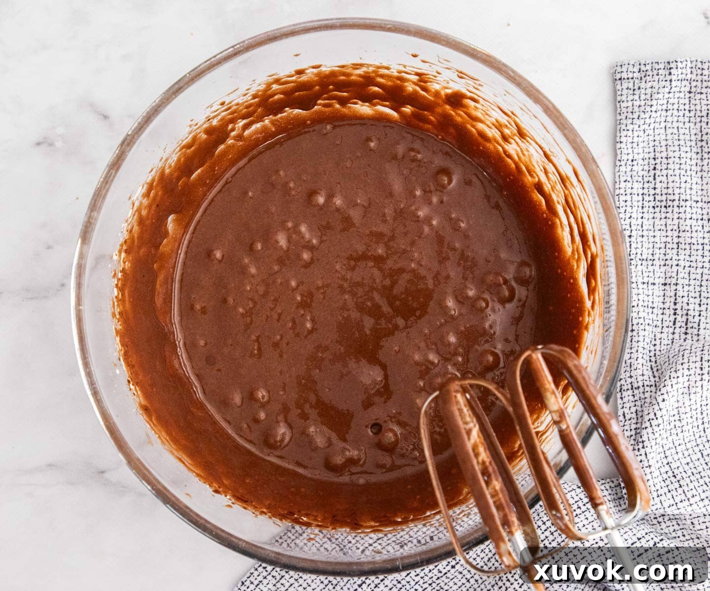 The brownie batter after the melted butter and chocolate mixture has been added and gently beaten in.