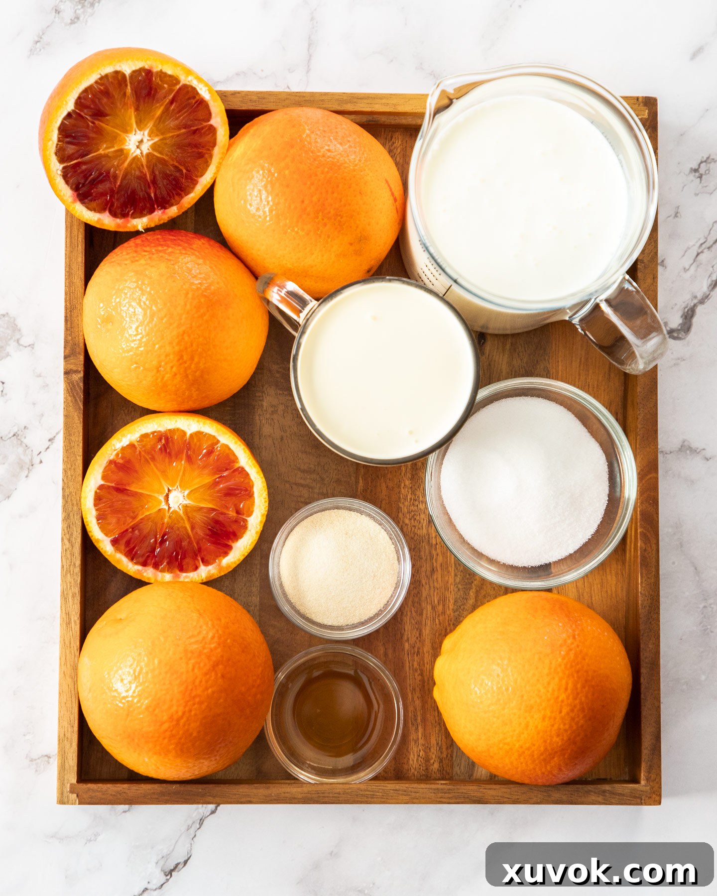 Ingredients for buttermilk panna cotta on a wooden tray.