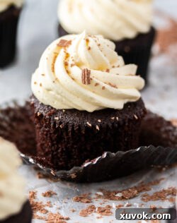 Super closeup of a chocolate mint cupcake, highlighting its textures and vibrant peppermint frosting.