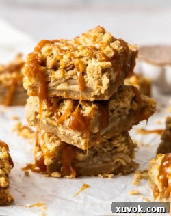 A stack of 3 salted caramel apple pie bars.
